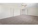 This bedroom features neutral walls, carpet and a ceiling fan with light at 3729 Meadow Glen Cir, Ellenwood, GA 30294