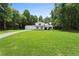 This two-story home shows manicured lawn, mature trees, a long driveway and great curb appeal at 3729 Meadow Glen Cir, Ellenwood, GA 30294