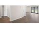 Hallway shows doors and hardwood flooring at 3729 Meadow Glen Cir, Ellenwood, GA 30294