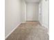 Hallway with carpeted floors and multiple doorways at 3729 Meadow Glen Cir, Ellenwood, GA 30294
