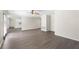 Open-concept living room featuring hardwood floors, neutral walls, and flowing access to the kitchen at 3729 Meadow Glen Cir, Ellenwood, GA 30294