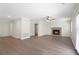 Spacious living room with hardwood floors, neutral walls, ceiling fan and a fireplace at 3729 Meadow Glen Cir, Ellenwood, GA 30294