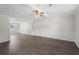 Open-concept living and dining areas features wood floors, crown molding, and modern lighting fixtures at 3729 Meadow Glen Cir, Ellenwood, GA 30294