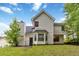Back exterior of home showing yard and upper windows at 4783 Creekside Pl, Decatur, GA 30035