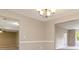 Well lit dining room with chandelier and neutral paint at 4783 Creekside Pl, Decatur, GA 30035