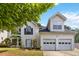 Charming two-story home features a two car garage and manicured landscaping at 4783 Creekside Pl, Decatur, GA 30035