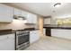 Efficient kitchen with white cabinets, stainless appliances, and neutral walls at 4783 Creekside Pl, Decatur, GA 30035