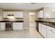 Bright kitchen with white cabinets, stainless appliances, and hard surface countertops at 4783 Creekside Pl, Decatur, GA 30035