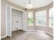 Bright laundry space with wood-look floors, shelving and plentiful natural light at 4783 Creekside Pl, Decatur, GA 30035