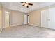 Main bedroom features plush carpet, tray ceiling, with private bath and closet access at 4783 Creekside Pl, Decatur, GA 30035