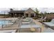 Community pool featuring sun-bathing chairs and shaded cabana areas for residents' leisure at 5440 Howington Ct # 190, Buford, GA 30518