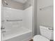 Bathroom with a tub/shower combo, grab bars, and a white finish at 5514 E Stoneway Ct, Villa Rica, GA 30180