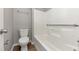 Bathroom featuring white tub and toilet at 5514 E Stoneway Ct, Villa Rica, GA 30180