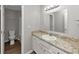 Bathroom featuring granite counters and white cabinetry at 5514 E Stoneway Ct, Villa Rica, GA 30180