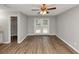 Empty bedroom with walk-in closet, double doors, and wood-look flooring at 5514 E Stoneway Ct, Villa Rica, GA 30180