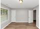 Bedroom featuring wood floors, two doors and a window at 5514 E Stoneway Ct, Villa Rica, GA 30180