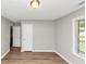 Bedroom featuring wood floors, two doors and a window at 5514 E Stoneway Ct, Villa Rica, GA 30180