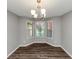 Cozy dining room area with unique lighting fixture and plenty of sunlight at 5514 E Stoneway Ct, Villa Rica, GA 30180