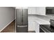 This kitchen features stainless steel appliances and white cabinetry at 5514 E Stoneway Ct, Villa Rica, GA 30180