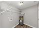 Utility room features wood floors, water heater and shelving at 5514 E Stoneway Ct, Villa Rica, GA 30180