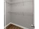 Walk-in closet with wire shelving, and wood-look flooring at 5514 E Stoneway Ct, Villa Rica, GA 30180