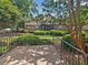 Back porch surrounded by lush landscaping with a view of the building, highlighting the outdoor space at 1175 Church St # B, Decatur, GA 30030