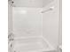 All-white bathroom features a bathtub and shower combination with tiled walls and updated fixtures at 1175 Church St # B, Decatur, GA 30030