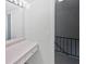 Bathroom vanity with a large mirror and staircase views at 1175 Church St # B, Decatur, GA 30030