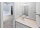 Bathroom features a white vanity, sink, and views into another room at 1175 Church St # B, Decatur, GA 30030
