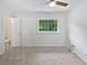 Bright bedroom with ceiling fan, window, and ensuite bathroom at 1175 Church St # B, Decatur, GA 30030