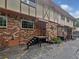 Attractive exterior of a multi-unit brick building with stairs leading to the entrance at 1175 Church St # B, Decatur, GA 30030