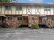 Charming brick exterior of a multi-unit building with private entrances and well-maintained landscaping at 1175 Church St # B, Decatur, GA 30030