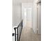 Bright hallway with neutral carpet leads to a bedroom or living space, showcasing a simple, modern design at 1175 Church St # B, Decatur, GA 30030