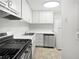 Efficient kitchen with stainless steel appliances, light cabinets, and modern fixtures at 1175 Church St # B, Decatur, GA 30030