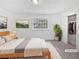 Inviting staged bedroom with plush bedding, natural light, and ample closet space at 1175 Church St # B, Decatur, GA 30030