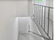 Bright staircase featuring neutral carpet, white walls, and a black railing for a simple, modern look at 1175 Church St # B, Decatur, GA 30030