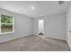 Large bedroom includes plush carpet, neutral paint, and an ensuite bathroom for convenience at 1998 Nuthatch Dr, Hoschton, GA 30548