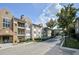 Beautiful brick apartment building featuring elegant balconies and lush landscaping at 220 Renaissance Ne Pkwy # 1105, Atlanta, GA 30308