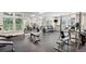 Bright gym features fitness equipment, weights, and mirrors for a complete workout experience at 220 Renaissance Ne Pkwy # 1105, Atlanta, GA 30308