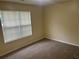 Bedroom features neutral walls and carpet at 2850 Cedar Trace Dr, Ellenwood, GA 30294