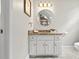A half bathroom with marble countertops, white cabinets and chrome finishes at 2976 Wilsons Crossing Ct, Decatur, GA 30033