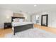Large main bedroom with hardwood floors, ceiling fan, and ensuite bathroom at 2976 Wilsons Crossing Ct, Decatur, GA 30033