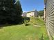 View of a well maintained backyard with green grass and an area for a garden at 3020 Whitfield Ave, Cumming, GA 30040