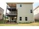 Two-story home with a large back porch with 2 levels overlooking the backyard at 3020 Whitfield Ave, Cumming, GA 30040