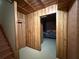 Unique unfinished basement featuring wood paneling at 3020 Whitfield Ave, Cumming, GA 30040