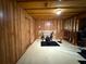 Basement features workout equipment and wood paneling at 3020 Whitfield Ave, Cumming, GA 30040
