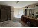 Well-lit bathroom with a soaking tub, walk-in shower, and dual vanity at 3020 Whitfield Ave, Cumming, GA 30040