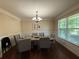 Bright dining room featuring table, stylish chandelier, and neutral color palette at 3020 Whitfield Ave, Cumming, GA 30040
