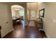 Bright entryway with hardwood floors, an arched doorway, and a glimpse of the dining room at 3020 Whitfield Ave, Cumming, GA 30040