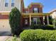 Charming two-story brick home with a well-manicured front yard and a welcoming covered porch at 3020 Whitfield Ave, Cumming, GA 30040